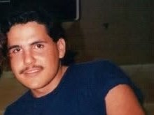 A young Juan with a mustache
