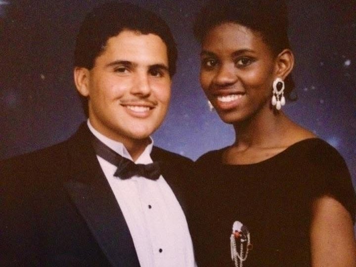 A young Juan in a tuxedo next to a woman in a black dress